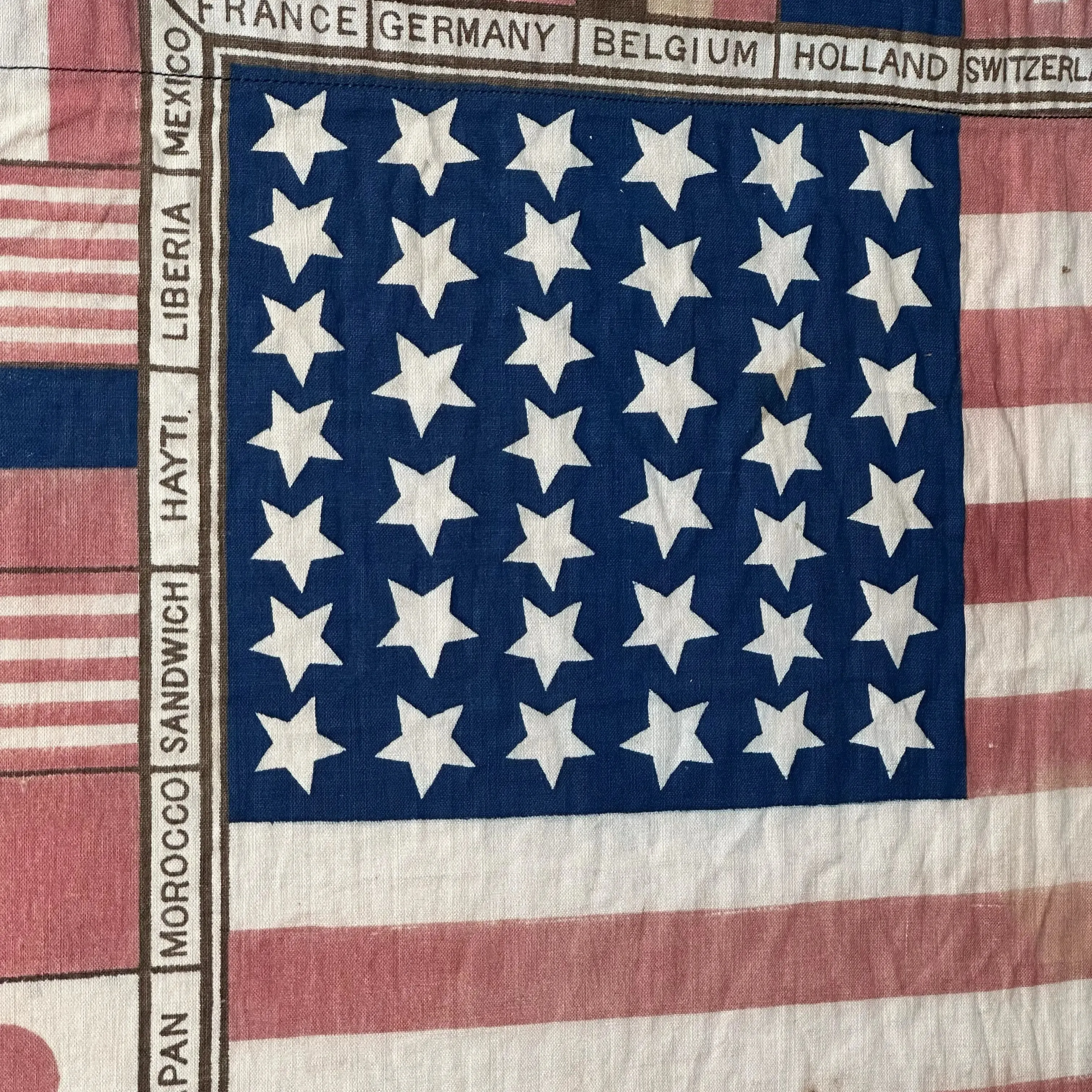 Printed for the 1876 Centennial Exhibition: US flag surrounded with the flags of participating nations — Framed